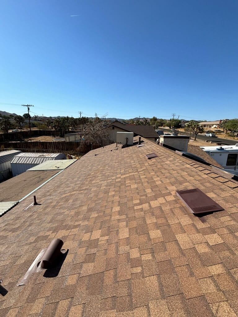 brown rooftop with vents and units, residential roof companies
